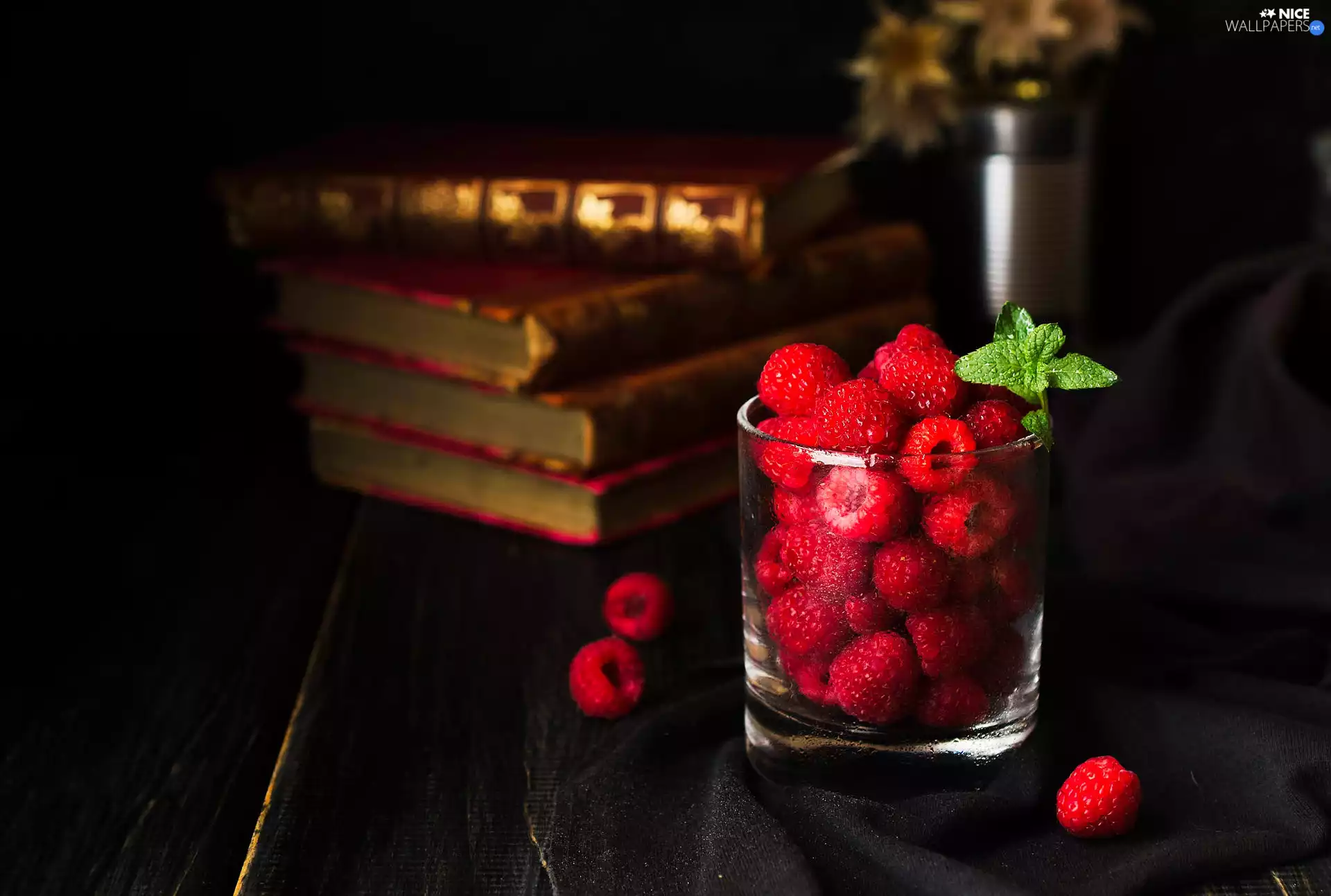 Books, raspberries, mint, cup
