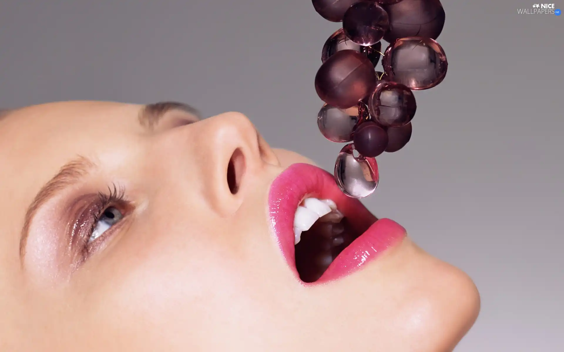 Women, glass, grapes, make-up