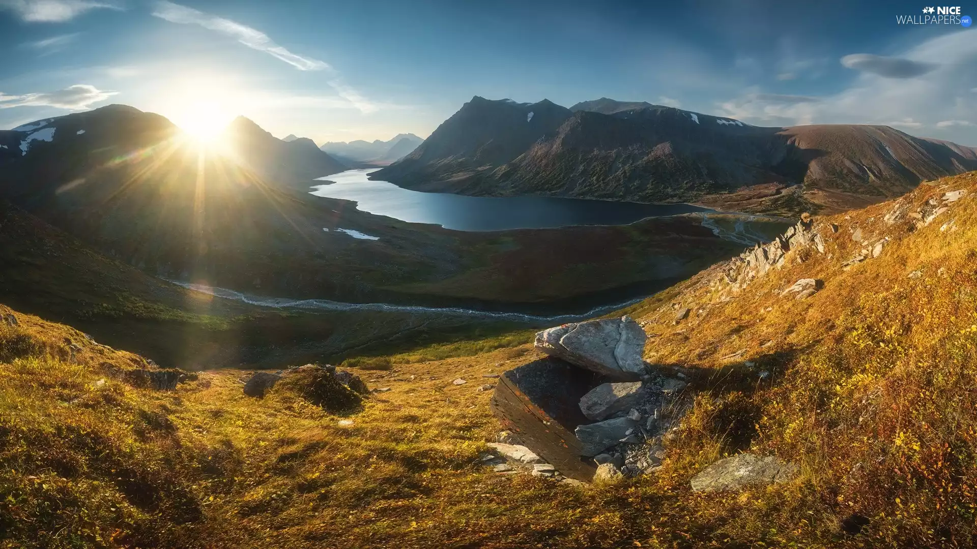 Mountains, rocks, rays of the Sun, River