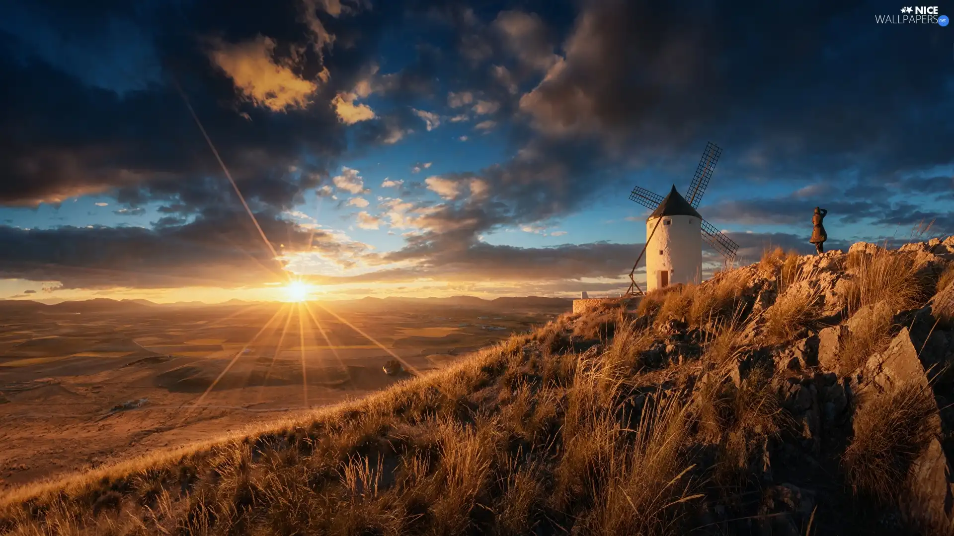 Windmill, Hill, rays of the Sun, rocks, clouds, grass, Meadow, Sky