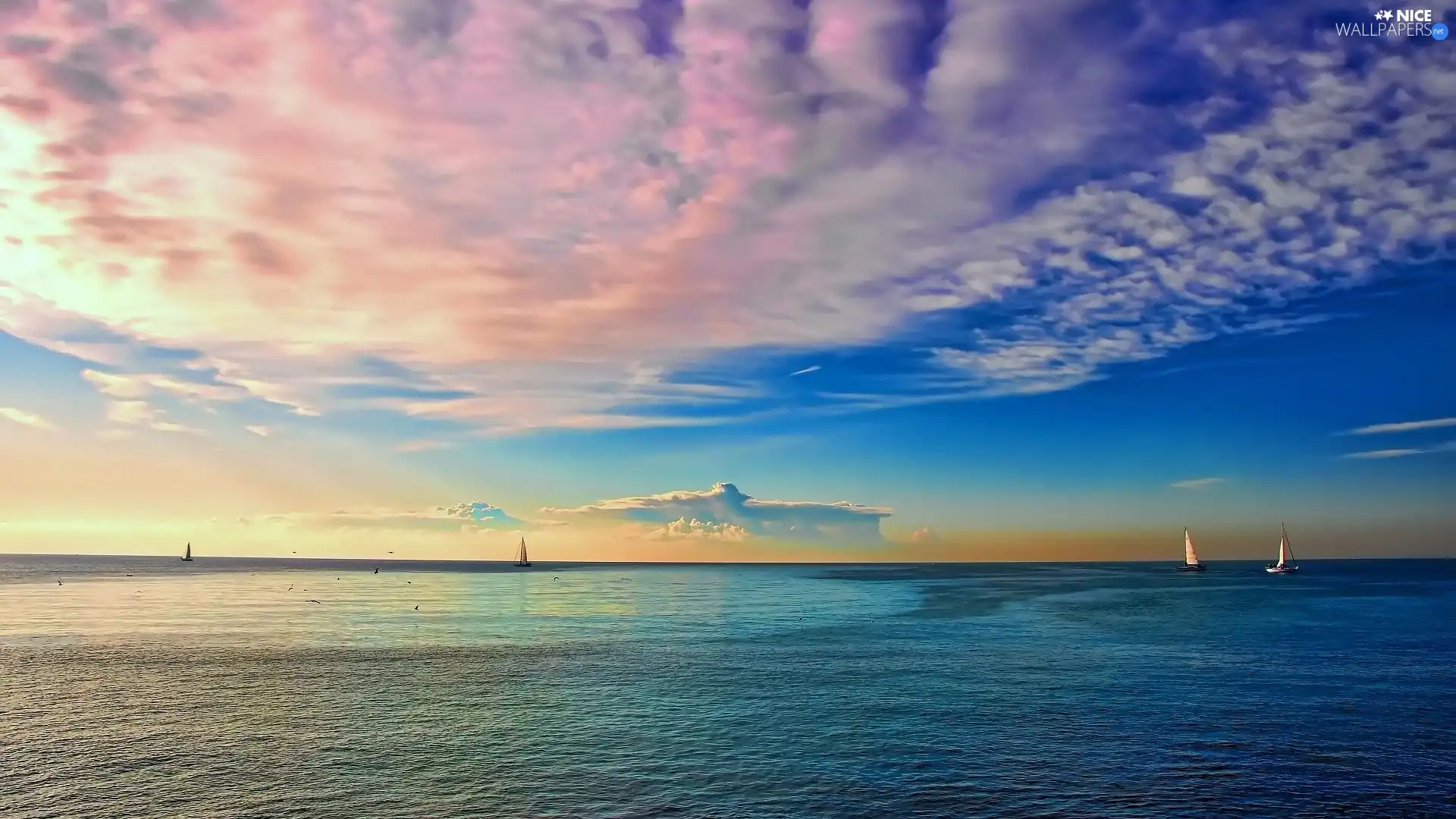 Sailboats, clouds, sea