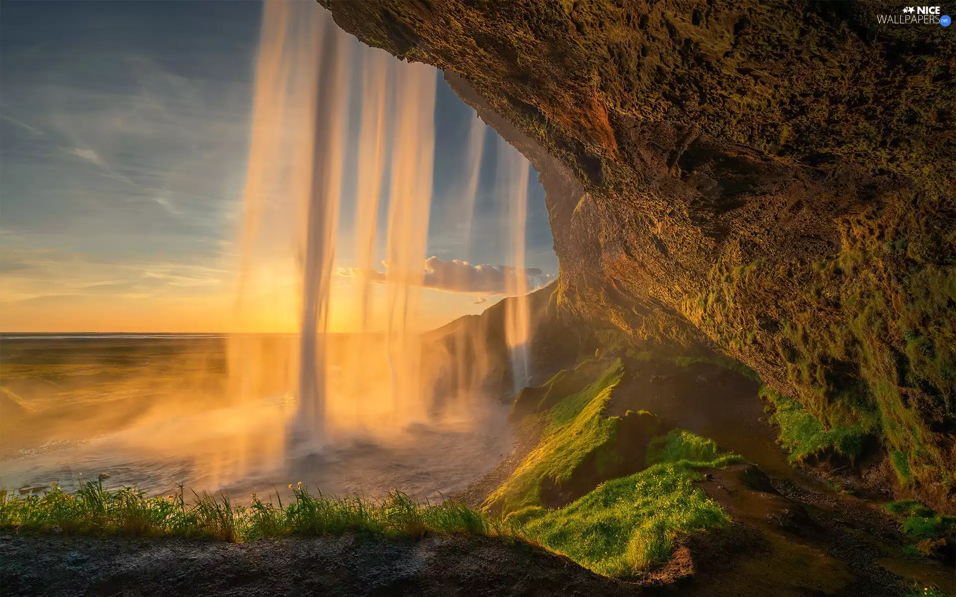 Seljalandsfoss Waterfall, rays of the Sun, rocks, illuminated, iceland
