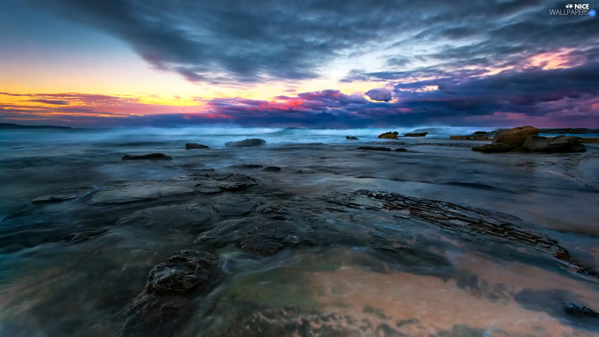 Stones, rays, sun, sea, east