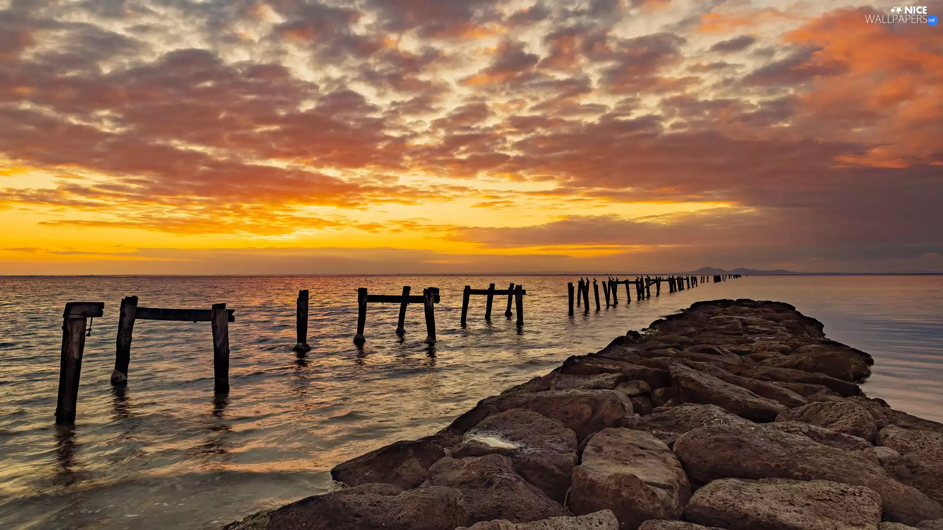 Pale, sea, Great Sunsets, clouds, rocks, wood