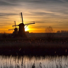 Windmills, sun, grass, west