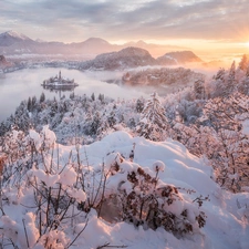 Slovenia, winter, Islet, Lake Bled, trees, rays of the Sun, Bush, Mountains, snow, viewes, Snowy