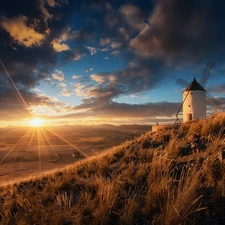 Windmill, Hill, rays of the Sun, rocks, clouds, grass, Meadow, Sky