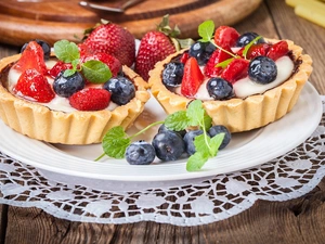 Muffins, blueberries, napkin, strawberries