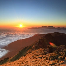 Mountains, rays, sun, clouds